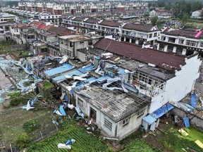 This aerial view shows damaged buildings