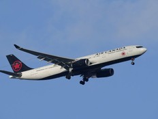 An Air Canada Airbus A330 approaches for landing in Lisbon