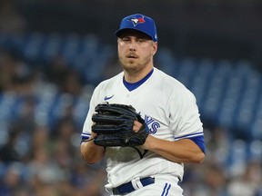 Toronto Blue Jays relief pitcher Erik Swanson pauses during American League MLB baseball action against the Houston Astros in Toronto on Thursday, June 8, 2023. The Blue Jays have reinstated Swanson from the 15-day injured list.