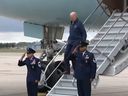 U.S. President Joe Biden almost tripping down staircase of Air Force One.