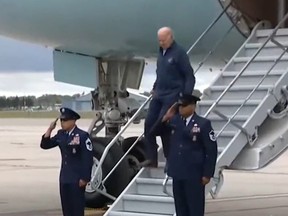 U.S. President Joe Biden almost tripping down staircase of Air Force One.