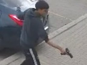 A man holding what looks like a gun.