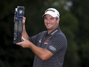 Ryan Fox of New Zealand poses with the trophy after day four of the 2023 PGA Championship at Wentworth Golf Club