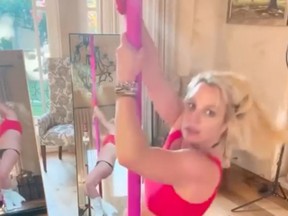 Britney Spears pole dances in an Instagram post.