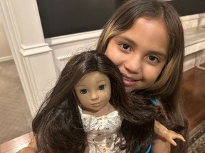 Valentina, 9, with Beatrice, an American Girl doll she calls her best friend.