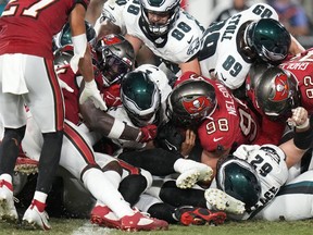 Philadelphia Eagles' Jalen Hurts, center, scores a touchdown during the second half of an NFL football game against the Tampa Bay Buccaneers, Monday, Sept. 25, 2023, in Tampa, Fla.