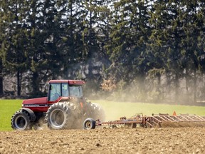 A farmer works a field in southwestern Ontario.