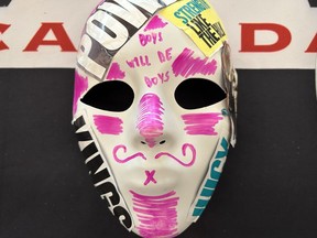 A mask, made by university hockey players as part of a research project, is seen on display at the Hockey Canada Beyond The Boards Summit, in Calgary, Alta., Friday, Sept. 8, 2023.
