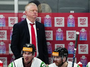 Hungary's head coach Kevin Constantine watches the group A match between United States and Hungary at the ice hockey world championship in Tampere, Finland, Sunday, May 14, 2023.