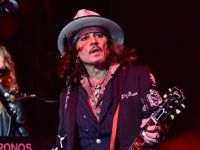 Johnny Depp is pictured performing at The O2 in London with The Hollywood Vampires in July 2023.