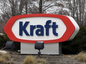 FILE - This March 25, 2015, file photo shows the Kraft logo outside of the company's headquarters in Northfield, Ill. Kraft Heinz is recalling individually-wrapped Kraft Singles American processed cheese slices because part of the wrapper could stick to the slice and become a choking hazard.