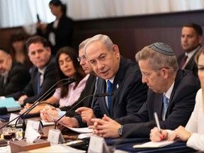 Israeli Prime Minister Benjamin Netanyahu (centre) chairs the weekly Cabinet meeting in Jerusalem on Sept. 10, 2023.