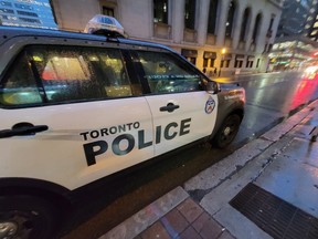 A Toronto Police vehicle is shown parked on Yonge St.