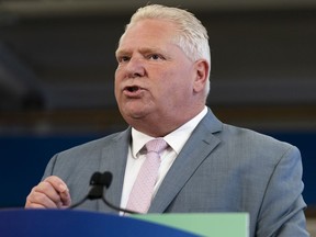 Ontario Premier Doug Ford delivers remarks at Lakeshore Collegiate Institute in Toronto, on Thursday, Aug. 31, 2023. Ford is calling on the Bank of Canada to halt future interest rate hikes which he says are having a "devastating" impact on families and businesses.