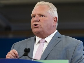 Ontario Premier Doug Ford delivers remarks at Lakeshore Collegiate Institute in Toronto, on Thursday, Aug. 31, 2023. Ford says he is reversing his plan to open the protected Greenbelt lands for housing development and won't make any changes to the Greenbelt in the future.
