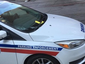 Toronto Parking Enforcement vehicle with ticket on windshield.