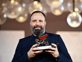 Director Yorgos Lanthimos poses with the Golden Lion for Best Film he reveived for "Poor Things" during a photocall for winners at the 80th Venice Film Festival on Sept. 9, 2023 at Venice Lido.