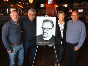 From left, on Aug. 29, brother Chad, parents, Lance and Candi, and brother Keith Pottruff, with a picture of Craig Pottruff who was killed in a car accident in B.C. earlier this month, had to deal with the bureaucracy of getting Craig's remains returned home due to a lack of pathologists.