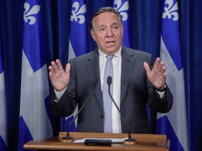 Quebec's police watchdog is investigating after a member of a provincial police tactical team shot a man suspected of making threats toward Premier François Legault and Prime Minster Justin Trudeau. Legault gestures as he speaks to the media on Wednesday, August 23, 2023, at the legislature in Quebec City.
