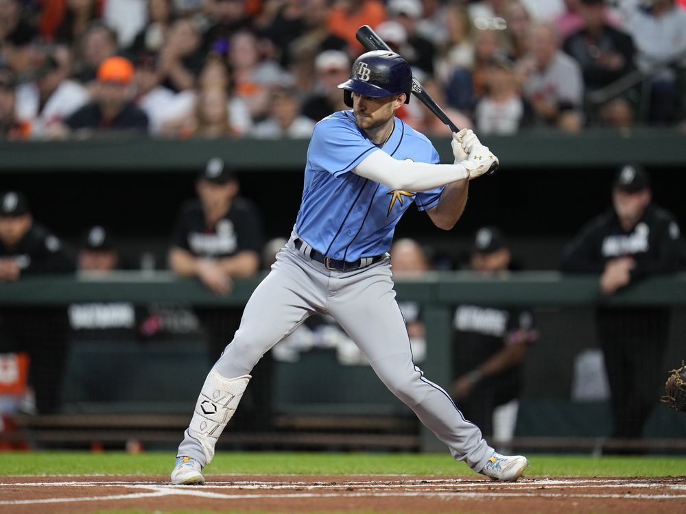 Tampa Bay Rays' Brandon Lowe throws his helmet after striking out