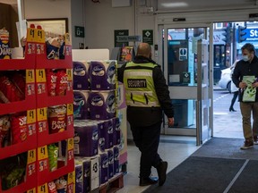 A security guard at a supermarket in London.