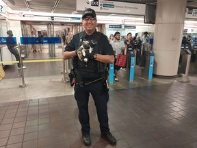 Const. Jazz Nijjar of Metro Vancouver Transit Police holds a rabbit named "Mercedes Sprinter" after it was caught running loose at downtown Vancouver's SkyTrain transit station in this Aug. 31, 2023 handout photo. The transit police reunited the support rabbit with her owner who says the bunny jumped the tracks as she was boarding a train.