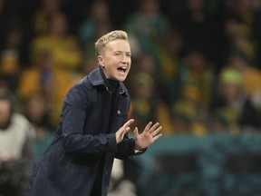 Canada coach Bev Priestman has stayed loyal to her World Cup squad, selecting 21 of the 23 tournament players for an Olympic qualifying playoff with Jamaica later this month. Priestman gestures during the Women's World Cup Group B soccer match between Australia and Canada in Melbourne, Australia, Monday, July 31, 2023.