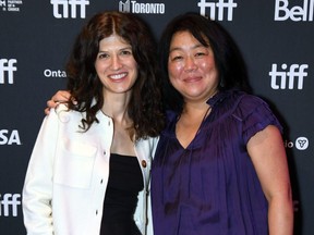 Cara Mones, left, and Caroline Suh attend the "Sorry/Not Sorry" premiere during the 2023 Toronto International Film Festival at Scotiabank on Sept. 10, 2023 in Toronto.