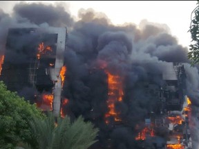 This picture taken on Sept. 17, 2023 shows a raging fire at the Greater Nile Petroleum Oil Company Tower in Khartoum.