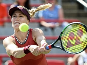 Eugenie Bouchard, from Canada, returns the ball to Danielle Collins, from the United States, during their qualifying match at the National Bank Open tennis tournament in Montreal, Saturday, August 5, 2023.