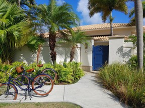 Each beachside suite features a small private courtyard (blue door) and a pair of bicycles for guests to use. (DAVE POLLARD/Toronto Sun)