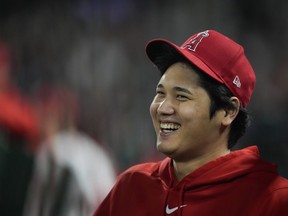 Los Angeles Angels' Shohei Ohtani laughs in the dugout