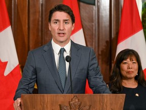 Prime Minister Justin Trudeau speaks alongside his International Trade Minister Mary Ng at a news conference during a stop in Singapore on September 8, 2023.