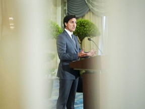 Prime Minister Justin Trudeau is reflected in a mirror