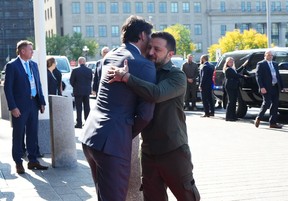 Prime Minister Justin Trudeau hugs Ukrainian President Volodymyr Zelenskyy as he arrives on Parliament Hill in Ottawa on Friday, Sept. 22, 2023.