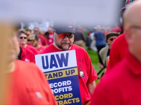 Members of the United Auto Workers (UAW) union hold a practice picket in front of Stellantis headquarters in Auburn Hills, Michigan, on Sept. 20, 2023.