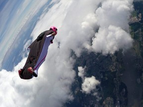 A person skydives while wearing a wingsuit in Norway.