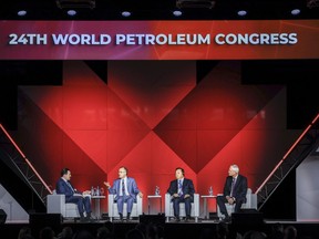 Joseph McMonigle, left to right, Secretary General, International Energy Forum, Amin Nasser, CEO of Saudi Aramco, Hou Qijun, President of China National Petroleum Corp., and Darren Woods, CEO of ExxonMobil, take part in a panel discussion at the World Petroleum Congress in Calgary, Monday, Sept. 18, 2023.THE CANADIAN PRESS/Jeff McIntosh