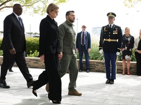 From left to right: U.S. Defense Secretary Llod Austin, Ukrainian first lady Olena Zelenska and President of Ukraine Volodymyr Zelenskyy leave after they participated in a wreath laying ceremony at the National Pentagon 9/11 Memorial on Sept. 21, 2023 in Arlington, Va.