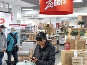 Hudson's Bay says it is expanding its Zellers brand to a slew of its department stores. Shoppers wander through a newly-opened Zellers store in Scarborough Town Centre Mall, in Toronto, Thursday, March 23, 2023.