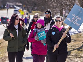 Teachers and support staff represented by the Ontario English Catholic Teachers' Association picket.