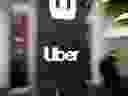 In this file photo taken on May 08, 2019 an Uber logo is seen outside the company's headquarters in San Francisco, California.  