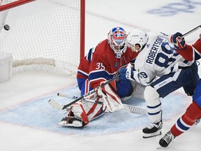 Toronto Maple Leafs' Nicholas Robertson (89) scores against Montreal Canadiens goaltender Samuel Montembeault as William Trudeau defends.
