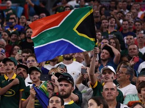 Spectators wave a South African national flag ahead of the France 2023 Rugby World Cup Pool B match between South Africa and Tonga.