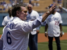 Former Los Angeles Dodgers first baseman Steve Garvey waves to fans prior to a baseball game between the Dodgers and the Colorado Rockies in 2021