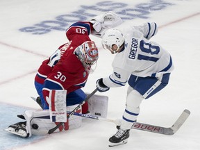 Montreal Canadiens' Cayden Primeau (30) stops a shot by Toronto Maple Leafs' Noah Gregor.