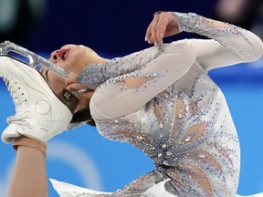 Mana Kawabe of Japan competes in the women's short program during the figure skating at the 2022 Winter Olympics,