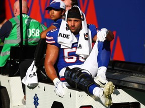 Matt Milano of the Buffalo Bills leaves the pitch after suffering an injury against the Jacksonville Jaguars.