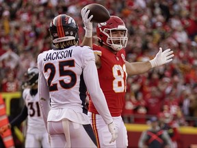 Kansas City Chiefs tight end Blake Bell, right, celebrates after scoring as Denver Broncos cornerback Lamar Jackson (25) watches during a game last year.