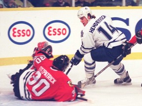 Maple Leafs centre Darby Hendrickson swoops in on fallen Blackhawks goalie Mark Fitzpatrick.